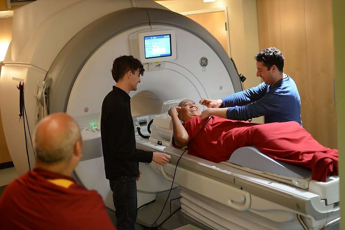 Meditator preparing for an MRI scan with Meditation Research Program researchers