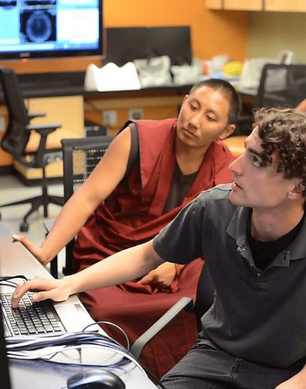 Matthew D. Sacchet at a workstation in the Meditation Research Program lab